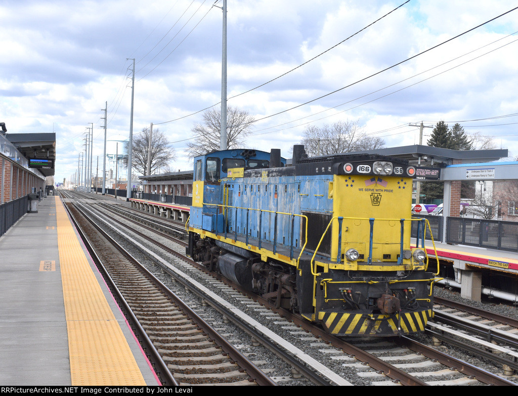 MP15AC # 166 heading solo westbound away from the NHP station 
